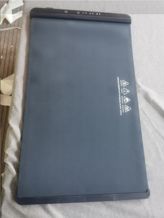 Warming tray partially rolled showing flexible silicone design
