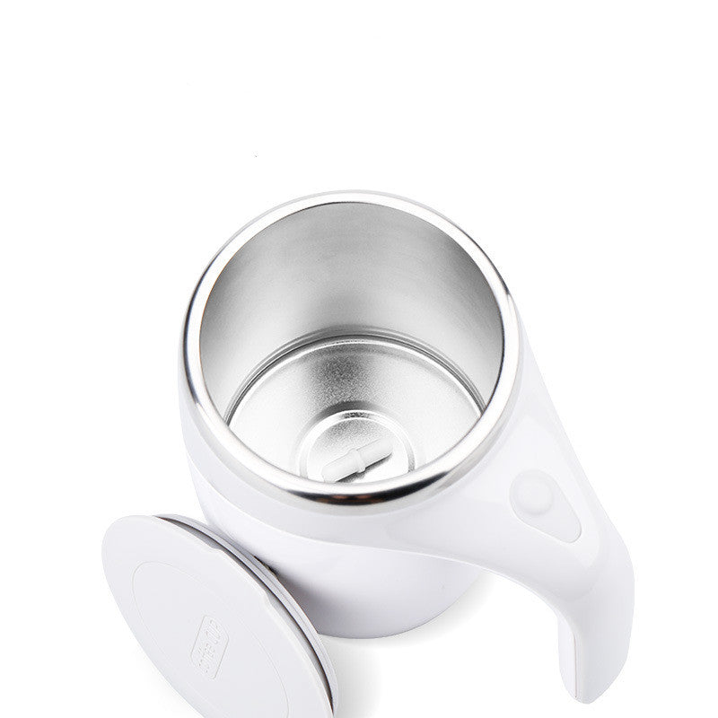 White magnetic stirring mug tilted to show the stainless steel inner liner